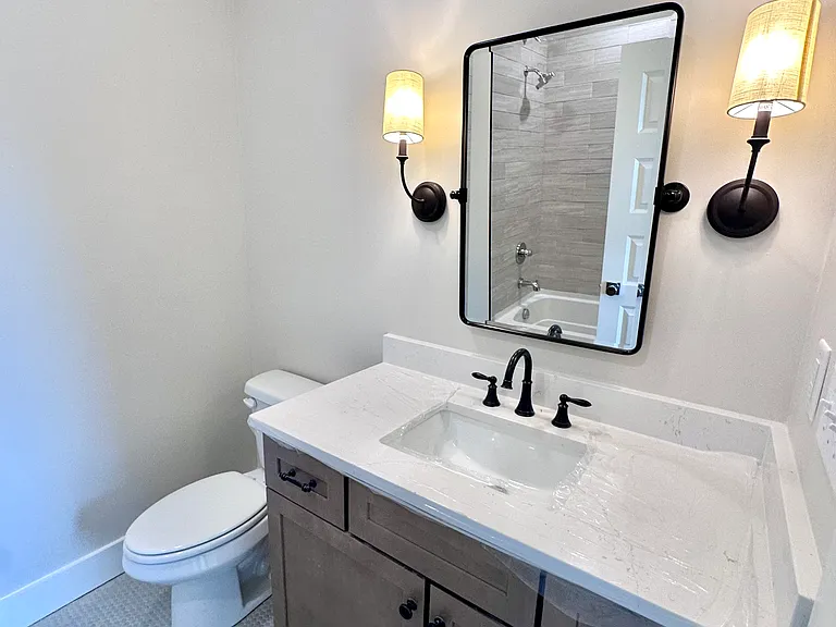 Well Appointed En-Suite Bath w/ Tile & Hard Counter Surfaces