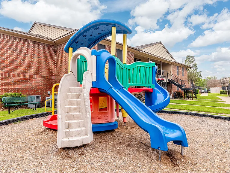 Playground with colorful slides and climbing structures