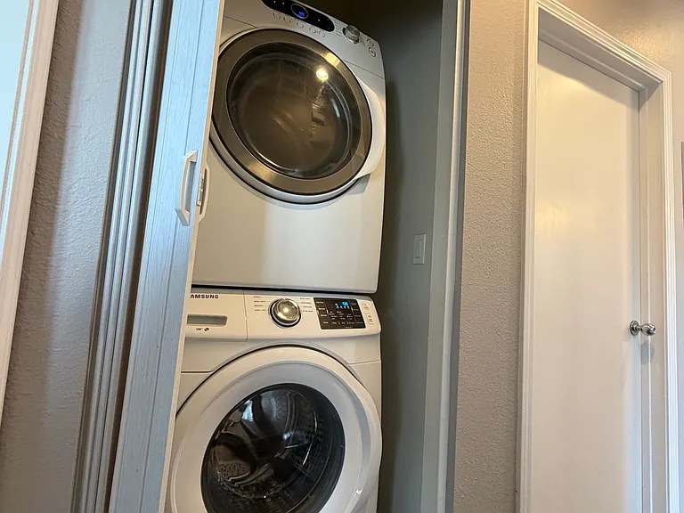 Full-size Samsung front-loading washer and dryer.