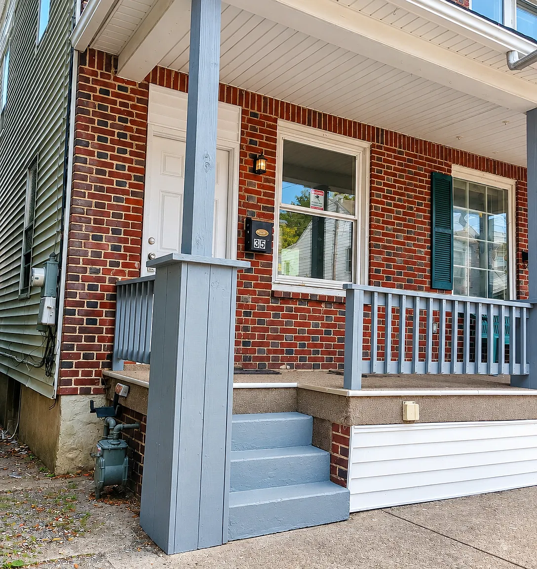 Spacious 4-Bedroom Home with Large Living Areas & Covered Porch — Photo 1