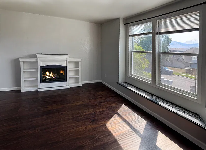 living room area with large windows with street view and natural gas fire place.