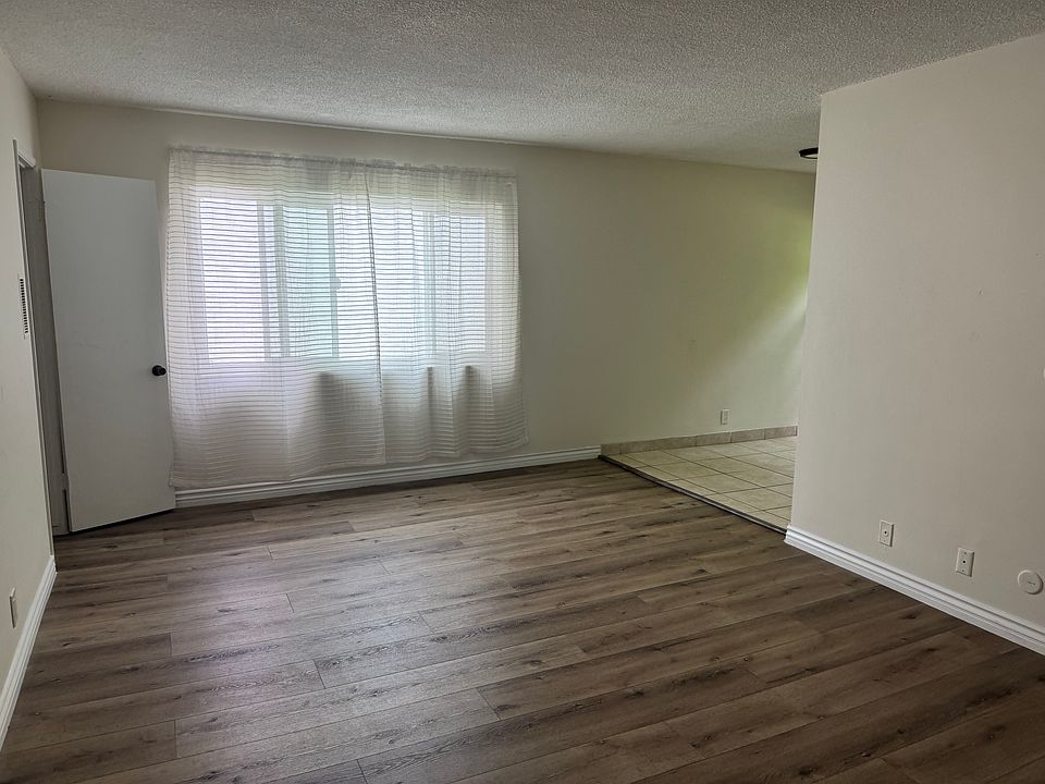 Living room walking toward dining room area.