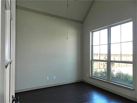 Study / office / flex room features French door entry and overlooks front yard.