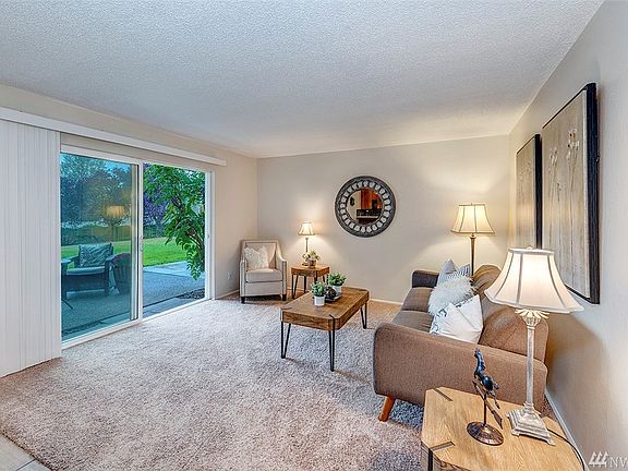 New Carpet In The Large Living Room. Walk-Out Access To The Private Patio Space. New Window Coverings And New Interior Paint Throughout The Unit.