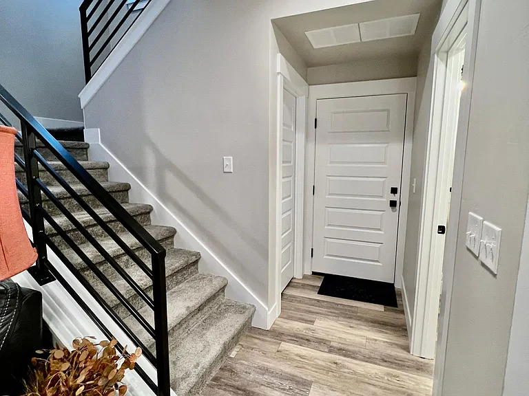 2 car attached garage through this door and storage under stairs.