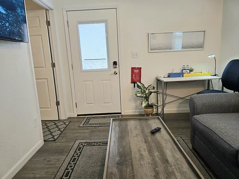 Your private door has built-in blinds. You'll have a desk with lamp & chair plus this lift-top coffee table.