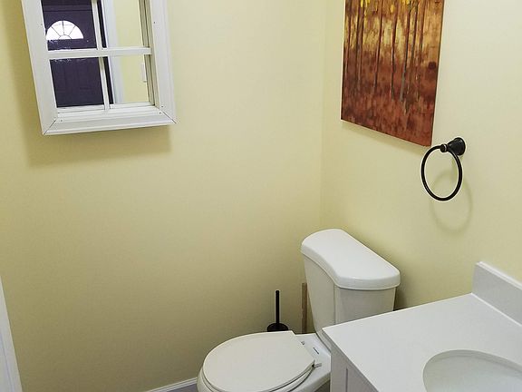 Half bath off living room/kitchen.