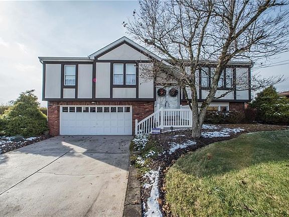 Includes convenient large driveway and 2 car garage.