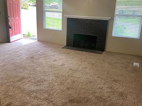 Wood burning fireplace in the living room.