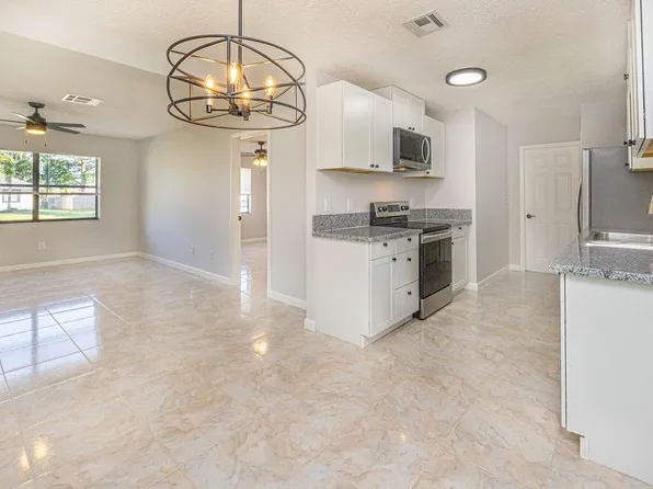 1041 SW Longfellow Road, Port St Lucie, FL 34953