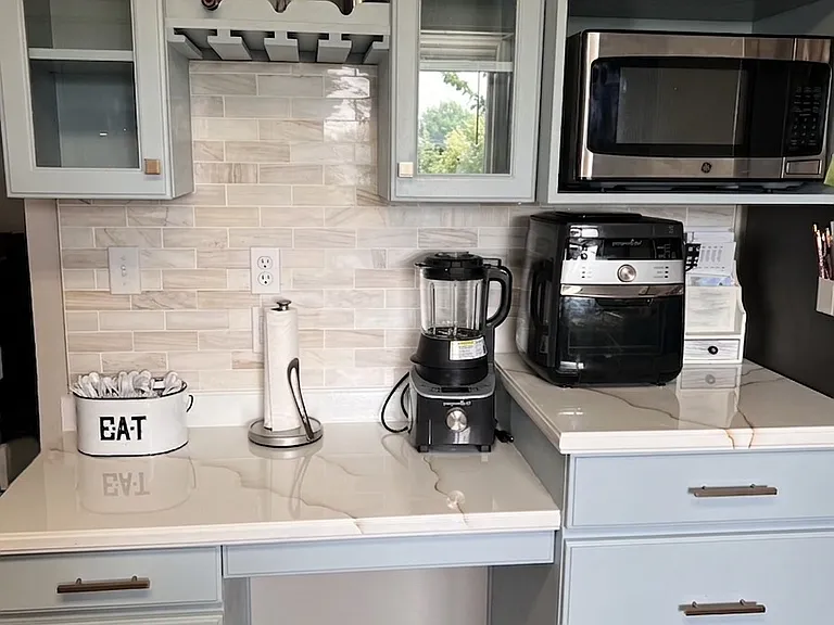 Microwave, wine glass and bottle built in storage space