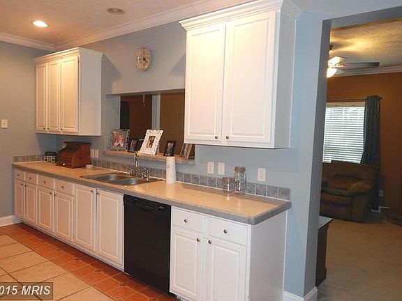 Kitchen with view into Family Room