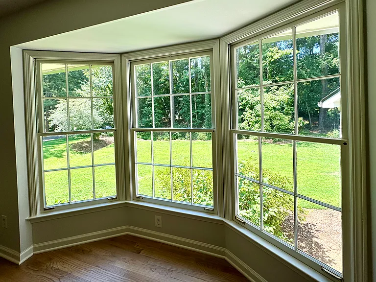 A light filled bay window overlooks the large backyard.
