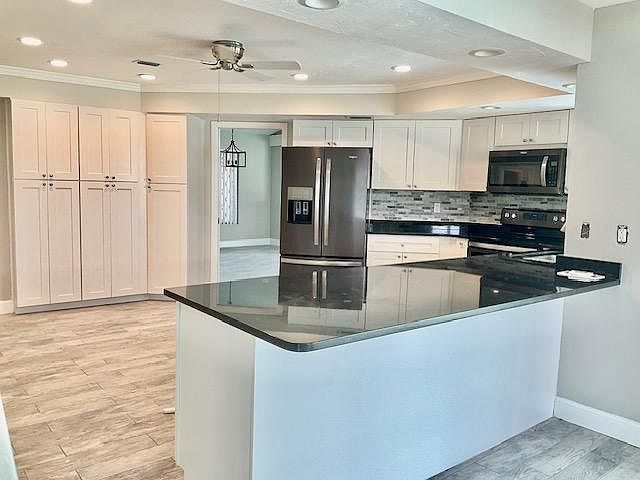 Plenty of cabinets and large pantry.