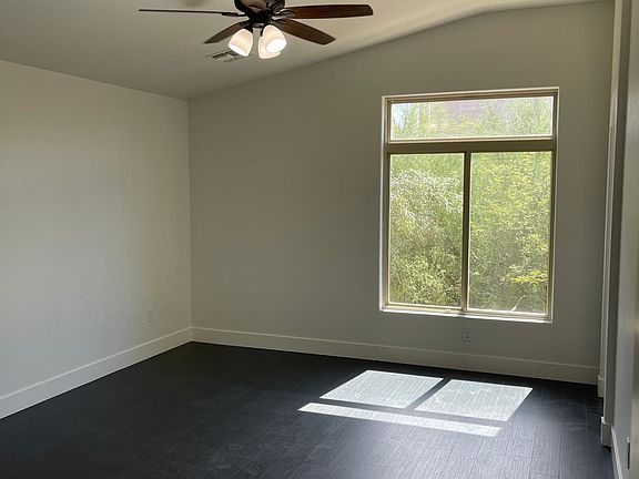 Large Master Bedroom with wood floors and walk in closet