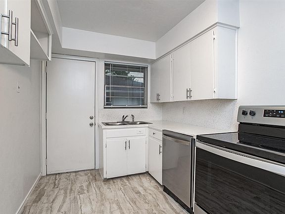 Kitchen with full size washer and dryer hook up