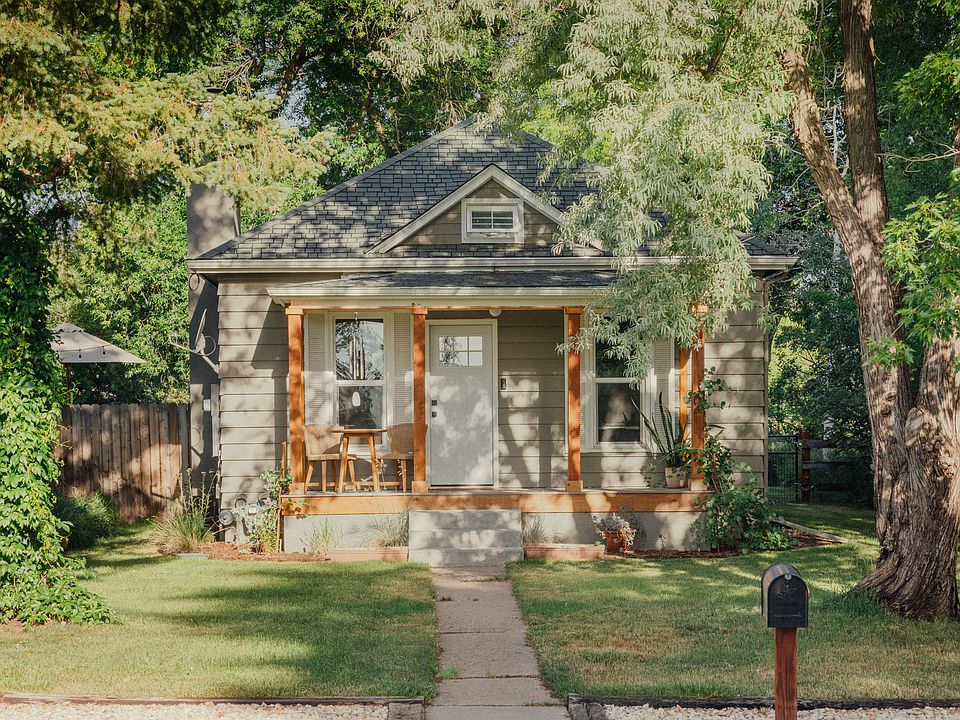 View from the street. The left window leads into the living room, while the right window leads into the office.