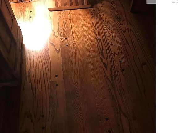 Hardwoods throughout home, including under carpet in master bedroom.  Fam room is the only pegged floor