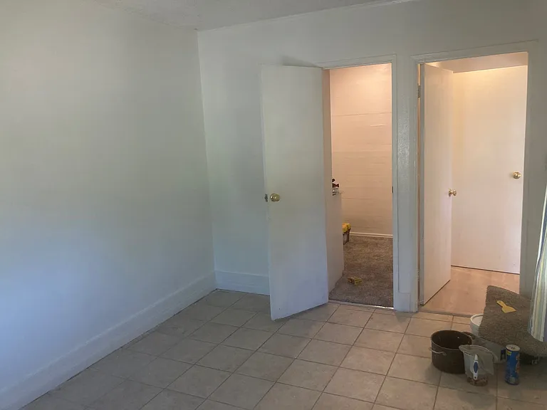 Master bedroom view from the eastern window. The open door on the left leads to the walk-in closet. The door on the right leads to the hall to the kitchen and bathrom