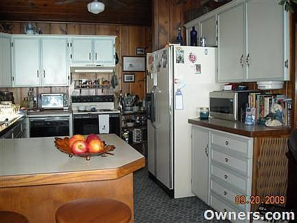 Kitchen (opens to Dining / Living)