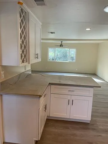 Quartz Kitchen Counter-Tops, Shaker Style Cabinetry, with a Wine Rack