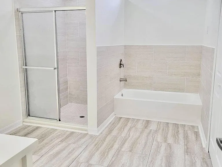 Updated master bathroom with separated shower and bath tub. Large walking closet not pictured
