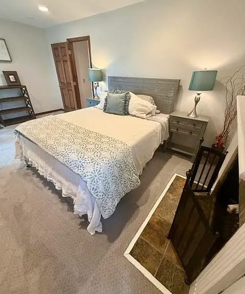 Second Story Primary Bedroom with Queen Plus Bed, Walk-In Closet, balcony and Gas Fireplace.