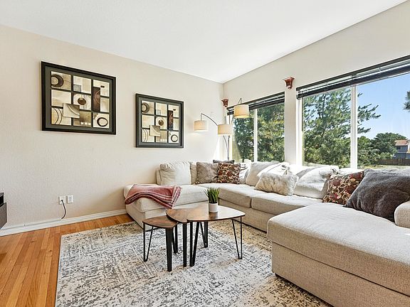 Neutral tones and hardwood-style flooring make decorating easy.