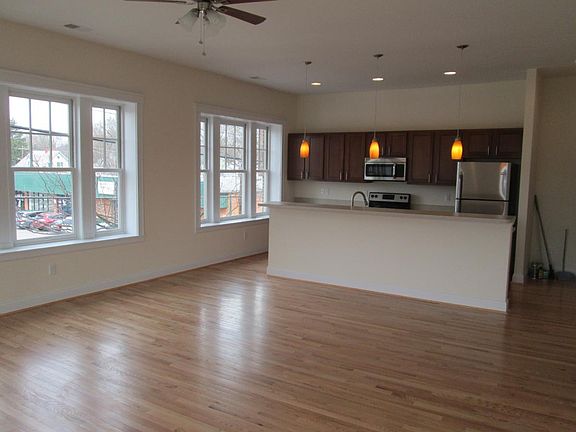 Open floor plan with hardwood floors