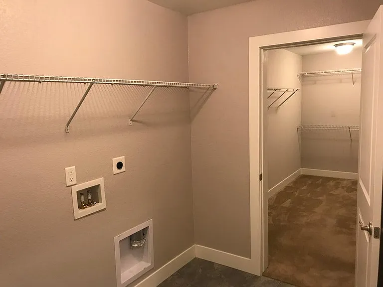 Laundry room into Master bedroom 1 closet.
