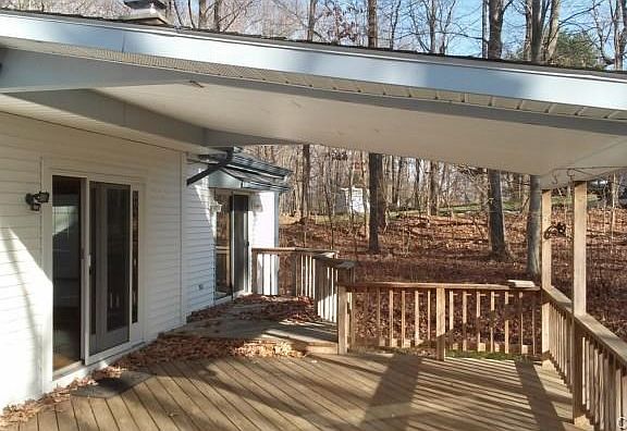 Super deck, moostly covered, offers spot to set up outdoors picn