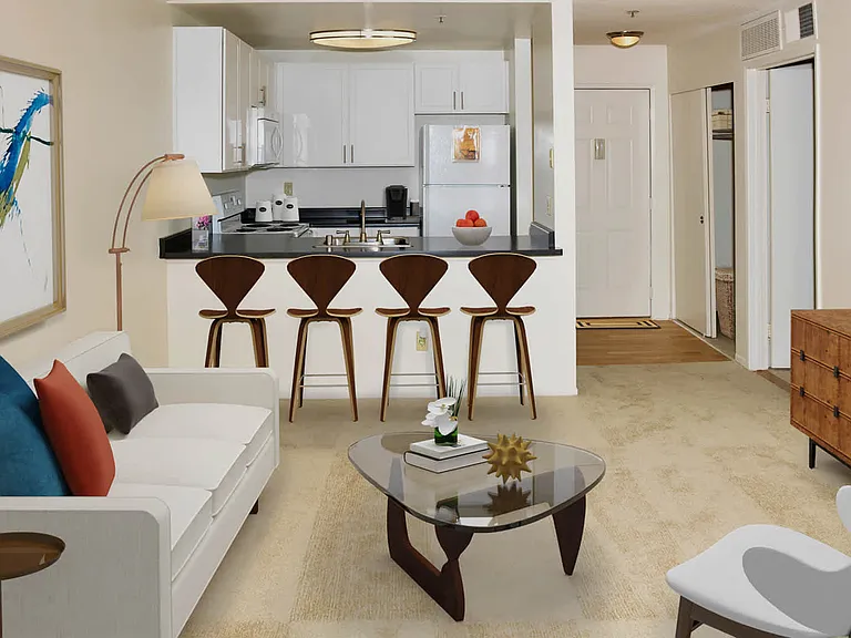 Kitchen and Carpeted Living Room