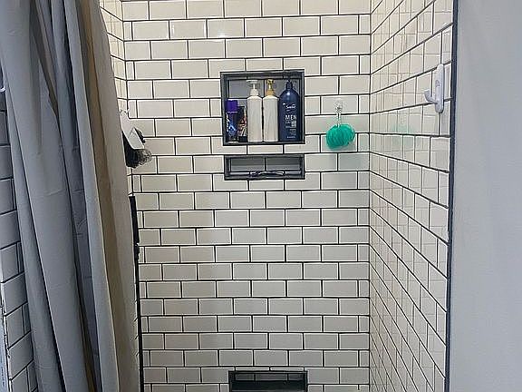Full subway tiled shower