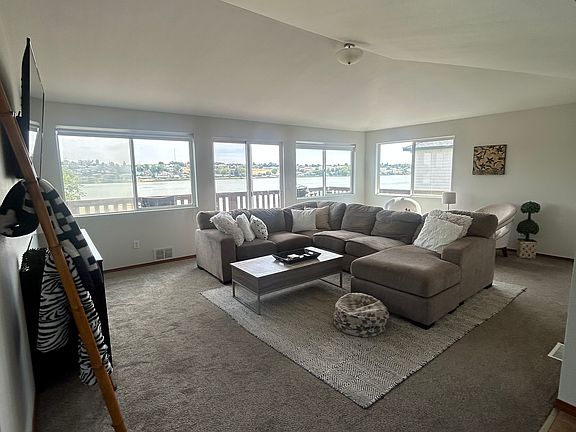 Living room on main floor. Vaulted ceilings