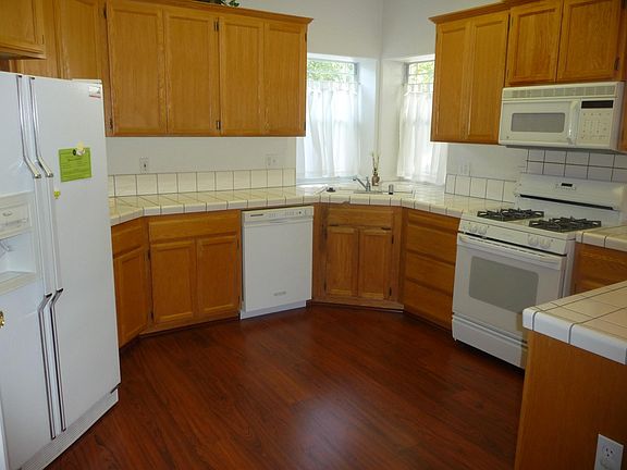 Wide kitchen area; low noise dishwasher; new stainless steel microwave; refrigerator included