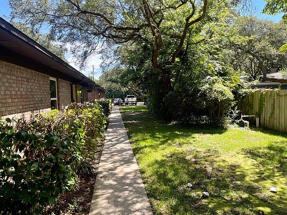 Unit D has a large beautiful yard that wraps around this unit