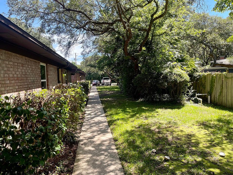 Unit D has a large beautiful yard that wraps around this unit