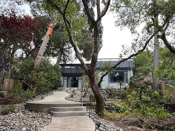 Pathway to front door, with private garden