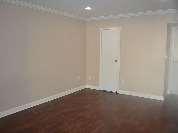 Master bedroom with wood plank tiles