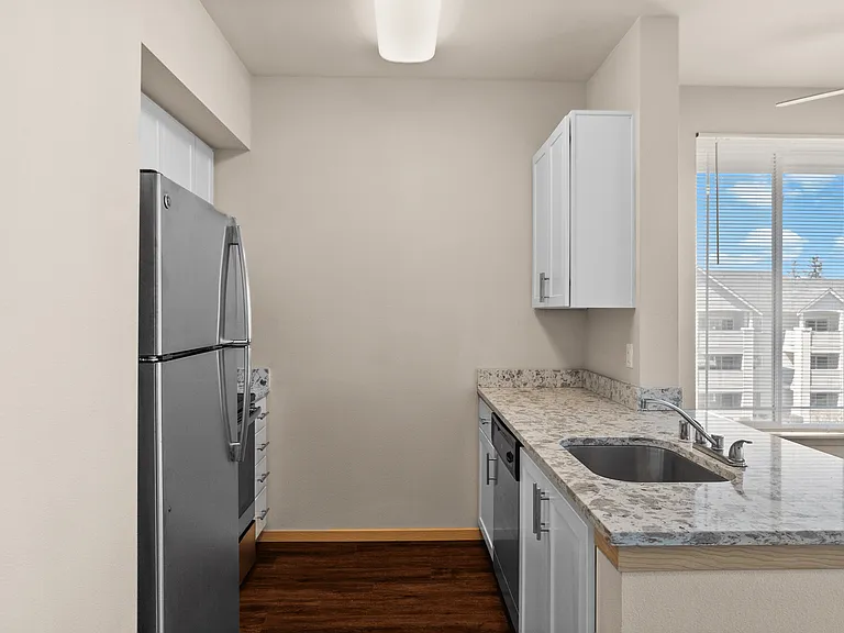 A sleek kitchen with updated finishes and bright natural light.