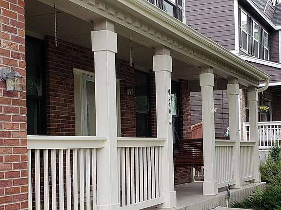 Large covered front porch with lovely swing