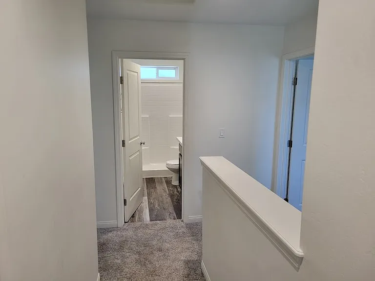 Upstairs hallway showing hall bath.