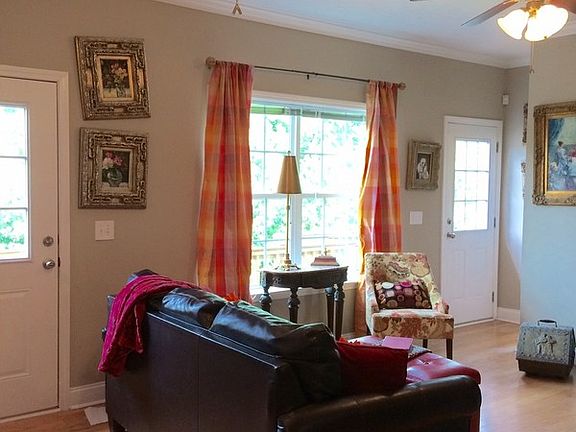 Great Room/Living Room : Beautiful view with two doors to deck. Open to Dining and Kitchen