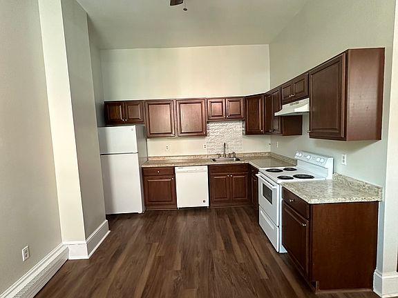 Large eat in kitchen with additional exit to back lot