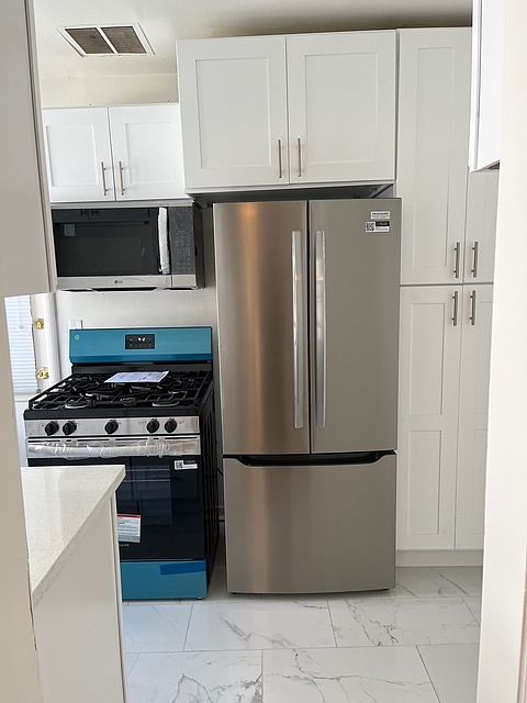 NEW SS STOVE / FRIDGE / MICROWAVE