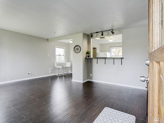 Swing open your front door to find lovely floors, fresh paint, and bright trim!