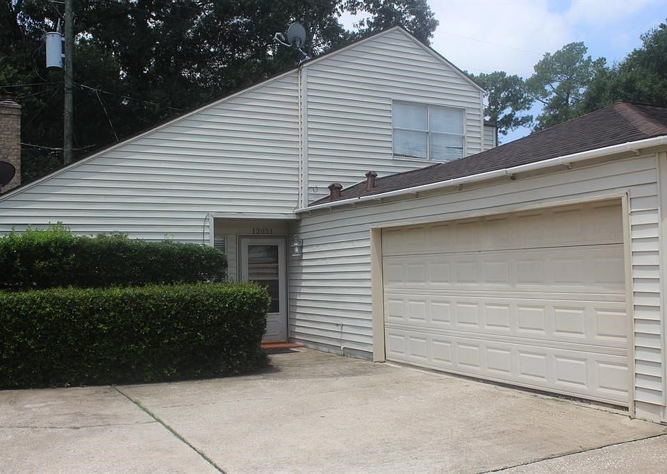 12031 Champion Forest Drive. 2 car garage , Nice size drive way. Patio Home