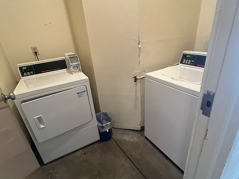 shared laundry for the 6 unit building. coin operated washer/dryer.