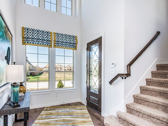 Grand entry with two-story ceiling