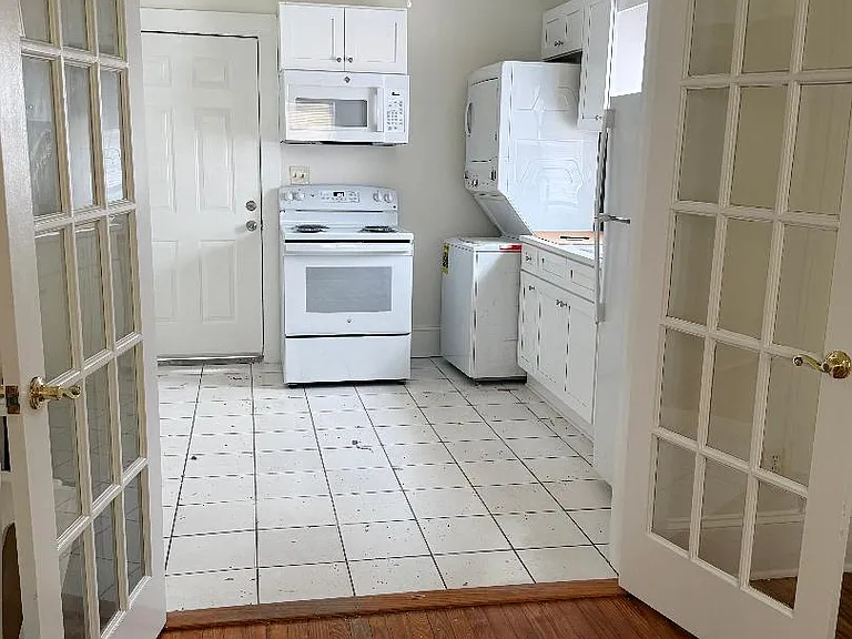 Kitchen view through open French door.